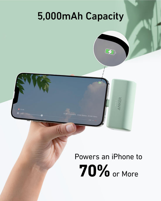 Anker power bank with built-in Lightning connector, 5000mAh capacity, compatible with iPhone 14/13/12 series, black color.