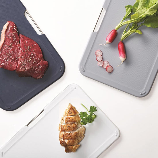Joseph Joseph cutting board set with storage stand - grey