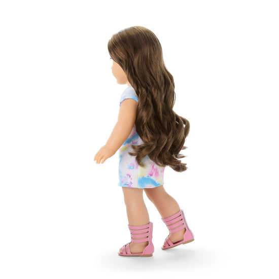 American Girl doll with blue eyes and wavy brown hair for ages 6+