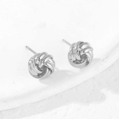Earring — 14K gold plated knot design in gold and silver tones