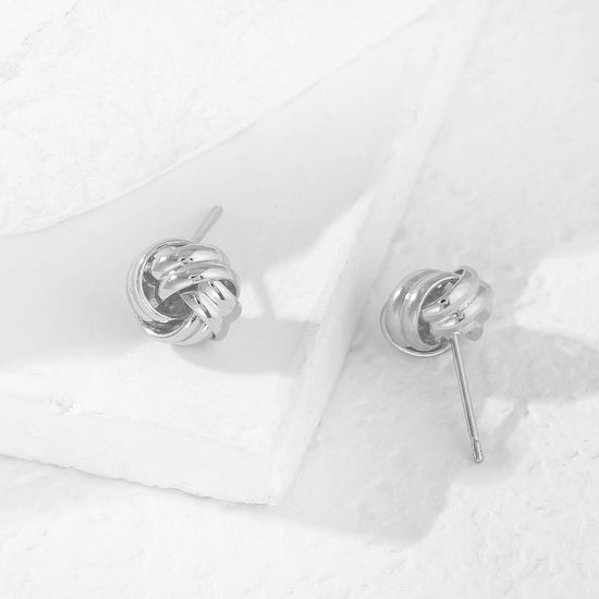 Earring — 14K gold plated knot design in gold and silver tones