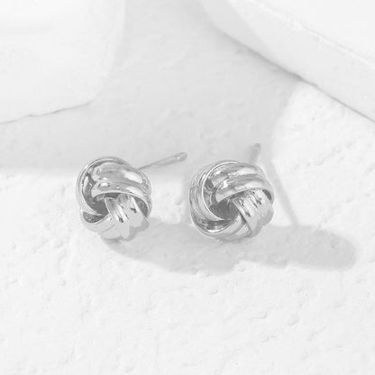 Earring — 14K gold plated knot design in gold and silver tones