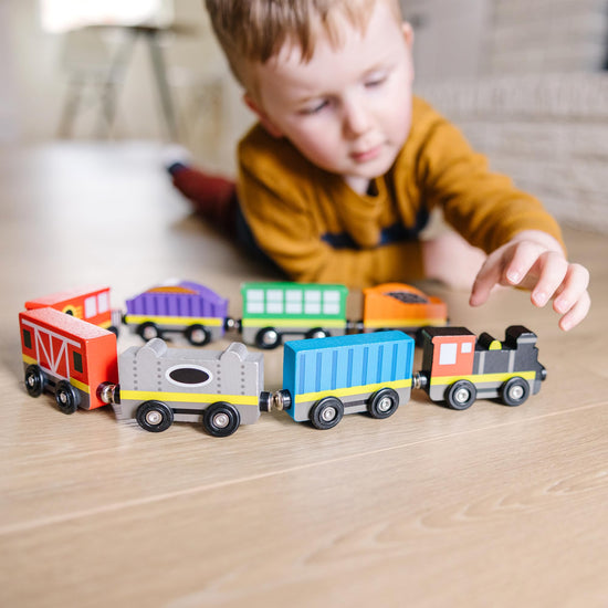Melissa & Doug wooden train set — 8-piece magnetic train cars with storage tray