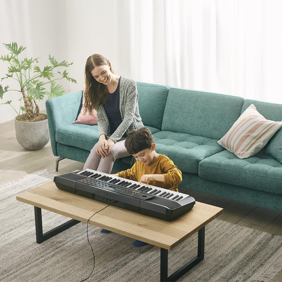 Portable keyboard with touch sensitive keys and music rest for beginners, power adapter included