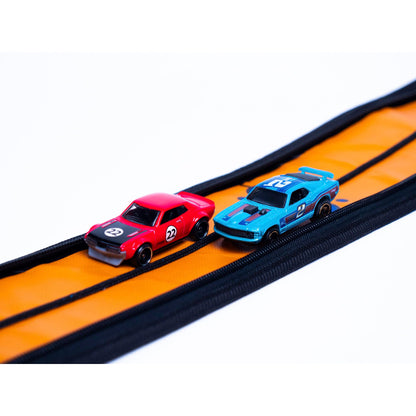 Toy vehicle set — ZipBin wheelie track pack unzips into a racetrack mat