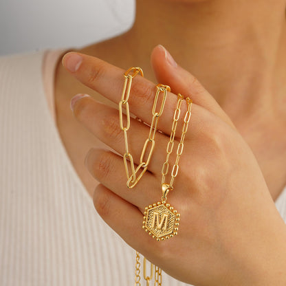 Necklace — Dainty initial design in 14K gold-plated finish by M MOOHAM