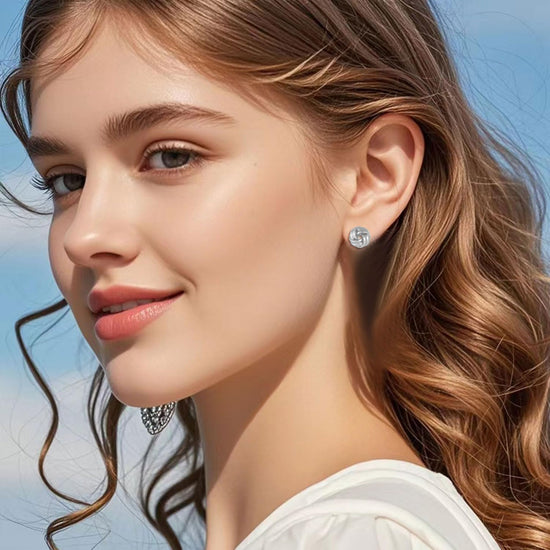 Earring — 14K gold plated knot design in gold and silver tones