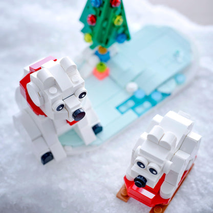 LEGO building blocks — wintertime polar bears with Christmas tree and two toys