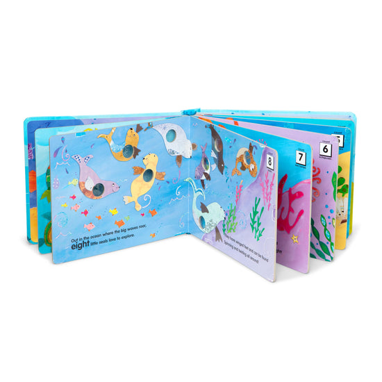 Melissa & Doug Poke-a-Dot children's board book with interactive buttons to pop