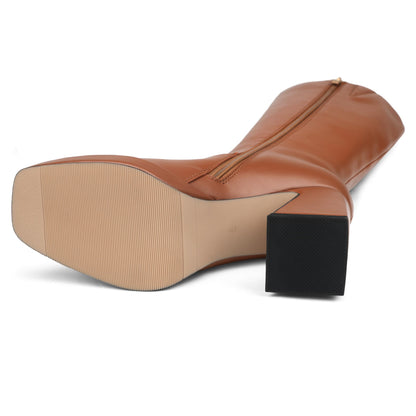 COLETER knee high gogo boots with chunky heel and zipper closure.