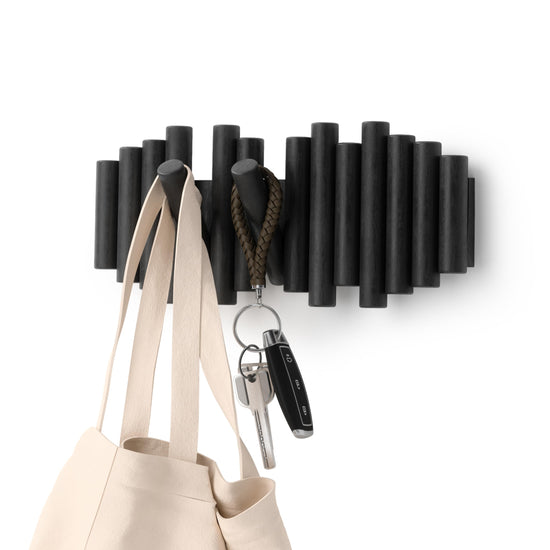 Umbra coat rack — wall-mounted design with hooks for storage