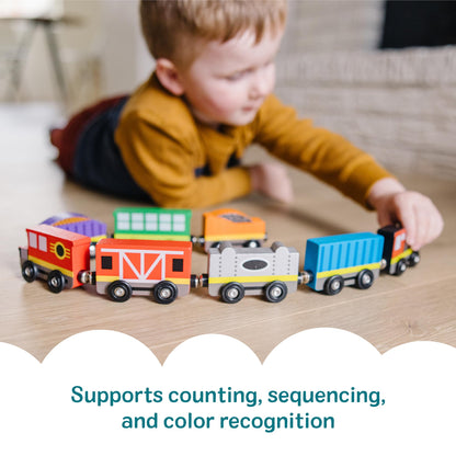 Melissa & Doug wooden train set — 8-piece magnetic train cars with storage tray