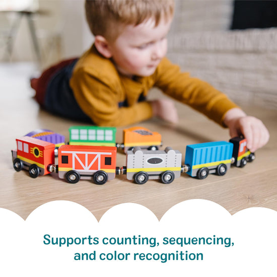 Melissa & Doug wooden train set — 8-piece magnetic train cars with storage tray