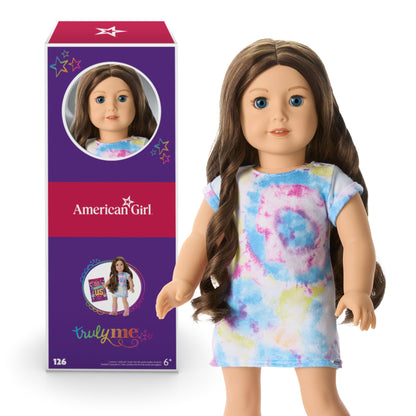American Girl doll with blue eyes and wavy brown hair for ages 6+