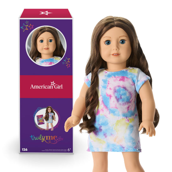 American Girl doll with blue eyes and wavy brown hair for ages 6+