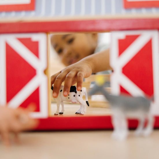 Melissa & Doug toy figure playset — foldable design for easy storage and transport
