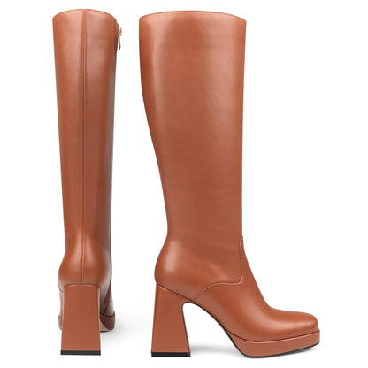 COLETER knee high gogo boots with chunky heel and zipper closure.