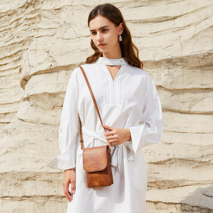 BOSTANTEN crossbody handbag with adjustable strap and vegan leather design.