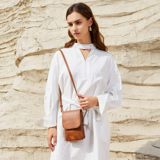 BOSTANTEN crossbody handbag with adjustable strap and vegan leather design.