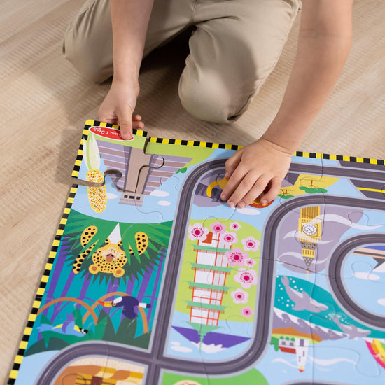 Melissa & Doug puzzles — Race around the world tracks with wind-up vehicles