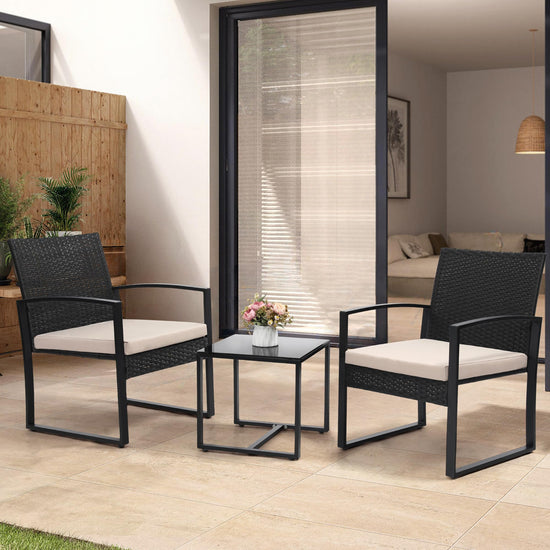 Murago 3 piece wicker patio bistro set with coffee table in black frame and cushion