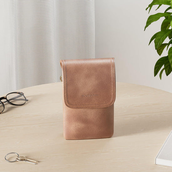 BOSTANTEN crossbody handbag with adjustable strap and vegan leather design.
