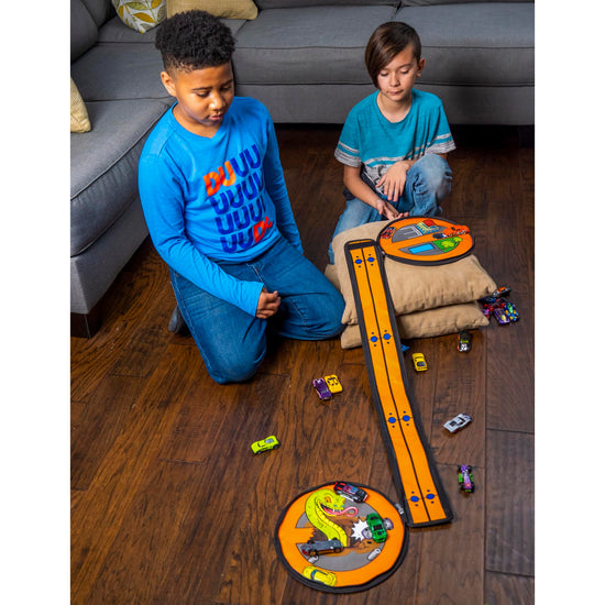Toy vehicle set — ZipBin wheelie track pack unzips into a racetrack mat