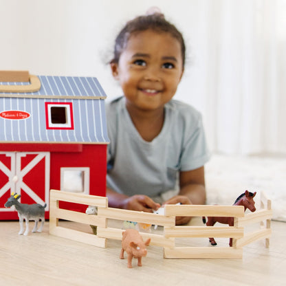 Melissa & Doug toy figure playset — foldable design for easy storage and transport