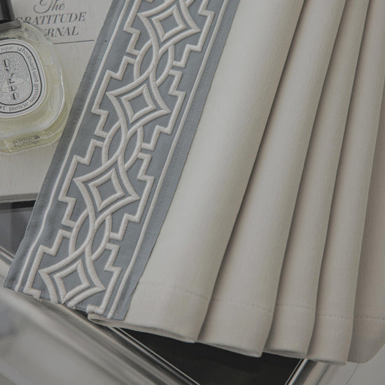 VisionaryHomeDesign curtain panels with embroidered design and tape trim