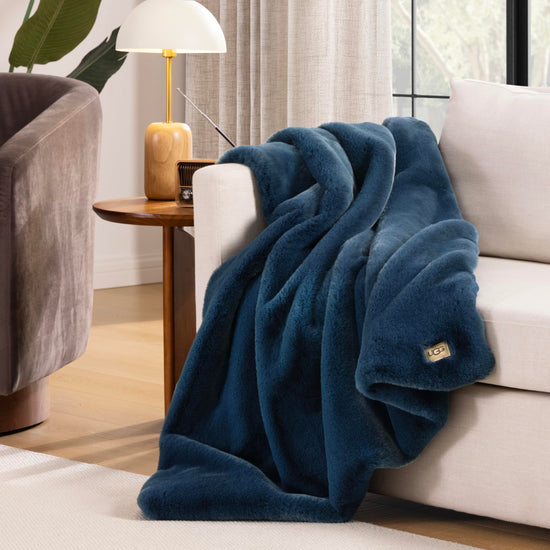 UGG Euphoria plush faux fur reversible blanket for luxury hotel style couch