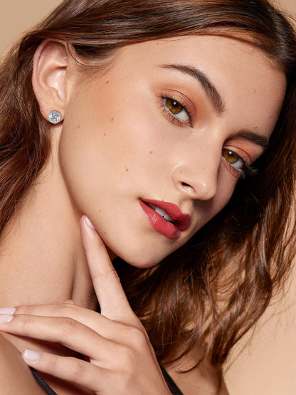 Earring — 14K gold plated knot design in gold and silver tones