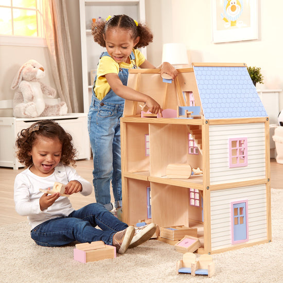 Miniature toy building — Melissa & Doug wooden multi-level dollhouse for kids